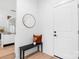 Bright entryway with a bench, mirror and view into kitchen area at 3001 Sparrow Springs Rd, Gastonia, NC 28052