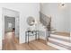 Bright and airy foyer with hardwood floors and elegant staircase at 3001 Sparrow Springs Rd, Gastonia, NC 28052