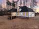 Stunning two-story home with covered porch and large windows at 3001 Sparrow Springs Rd, Gastonia, NC 28052