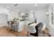 Bright kitchen featuring white cabinets, granite countertops, and breakfast bar at 3001 Sparrow Springs Rd, Gastonia, NC 28052