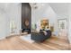 Spacious living area with a floor-to-ceiling fireplace and large windows at 3001 Sparrow Springs Rd, Gastonia, NC 28052
