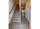 Welcoming entryway with hardwood floors and a carpeted staircase at 4077 Port Richmond Ave # 18, Gastonia, NC 28056