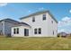 Backyard view of a two-story home with white siding and a well-maintained lawn at 203 Alden Ct, Shelby, NC 28152