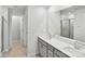 Bright bathroom featuring a double vanity, tile floors, and a glass-enclosed shower at 203 Alden Ct, Shelby, NC 28152
