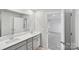 This modern bathroom features dual sink vanity and large mirror at 203 Alden Ct, Shelby, NC 28152