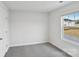 This bedroom features neutral carpeting and a window with neighborhood views at 203 Alden Ct, Shelby, NC 28152