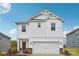 Charming two-story home with a white exterior, attached garage, and manicured lawn at 203 Alden Ct, Shelby, NC 28152