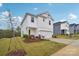 Attractive two-story home with a lush lawn and a driveway leading to a garage at 203 Alden Ct, Shelby, NC 28152