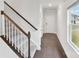 Bright hallway with hardwood floors, leading to a staircase and other rooms at 203 Alden Ct, Shelby, NC 28152