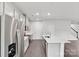 This open kitchen features modern gray cabinets, stainless steel appliances, and large island at 203 Alden Ct, Shelby, NC 28152