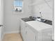 Modern laundry room with side-by-side washer and dryer at 203 Alden Ct, Shelby, NC 28152
