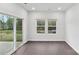 Bright living room with hardwood floors, large windows, and a sliding glass door at 203 Alden Ct, Shelby, NC 28152