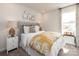 Bright bedroom with a patterned bedspread and stylish wall decorations over the headboard at 205 Alden Ct, Shelby, NC 28152