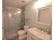 Relaxing bathroom features a glass shower, a vanity, a modern toilet, and cool paint at 18867 Vineyard Point Ln, Cornelius, NC 28031