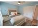 A lovely bedroom with wood-look flooring, soft natural light, and neutral colors at 18867 Vineyard Point Ln, Cornelius, NC 28031