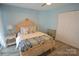 A calming primary bedroom with wood-look flooring and natural light at 18867 Vineyard Point Ln, Cornelius, NC 28031