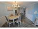 Elegant dining area featuring a chandelier, comfortable seating, and plenty of natural light at 18867 Vineyard Point Ln, Cornelius, NC 28031