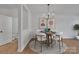 Dining area with a wooden table and chairs, view of the bathroom at 5346 Johnston Mill Ct, Charlotte, NC 28269