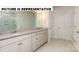 Elegant bathroom with granite countertops and a double vanity at 131 Sari St, Troutman, NC 28166
