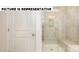 Clean bathroom with a tiled shower and built-in seat at 131 Sari St, Troutman, NC 28166