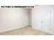 Spacious bedroom with double doors and carpeted floors at 131 Sari St, Troutman, NC 28166