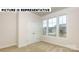 Well-lit bedroom with double doors and a large window at 131 Sari St, Troutman, NC 28166