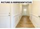 Bright entryway with wood-look floors and white wainscoting at 131 Sari St, Troutman, NC 28166