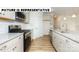 Kitchen features granite countertops and stainless steel appliances at 131 Sari St, Troutman, NC 28166