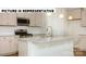 Kitchen with granite countertops, stainless steel appliances, and white cabinets at 131 Sari St, Troutman, NC 28166