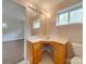 Bathroom features a vanity with light wood cabinets, white countertop, and a large mirror at 2626 S Main St, Concord, NC 28027