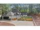 Aerial view of a beautiful home with a well-manicured lawn, deck, and a two-car garage at 2733 Wellington St, Rock Hill, SC 29732