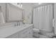 Updated bathroom featuring a single vanity, updated fixtures, and a tub-shower combo with a shower curtain at 2733 Wellington St, Rock Hill, SC 29732