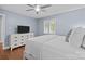 Relaxing bedroom showcasing hardwood floors, a ceiling fan, a window with shutters, and a white dresser at 2733 Wellington St, Rock Hill, SC 29732