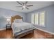 Serene bedroom with natural light from shuttered windows, ceiling fan, and hardwood floors at 2733 Wellington St, Rock Hill, SC 29732