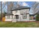 Charming two-story home with black and white accents, landscaped yard, and traditional architectural details at 2733 Wellington St, Rock Hill, SC 29732