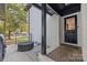 Charming front porch featuring a black door, mosaic tile, and a covered seating area at 2733 Wellington St, Rock Hill, SC 29732