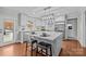 Bright, modern kitchen with white cabinets, stainless steel appliances, and an island with bar seating at 2733 Wellington St, Rock Hill, SC 29732