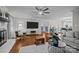 Spacious living room with fireplace, large TV, and hardwood floors throughout at 2733 Wellington St, Rock Hill, SC 29732