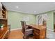 Well-lit office featuring a wooden desk, a comfortable leather chair, and classic hardwood flooring at 2733 Wellington St, Rock Hill, SC 29732