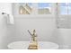 Soaking tub with modern fixtures and a view from the window at 4069 Rivendell Rd # 5, Denver, NC 28037