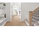 Hallway featuring hardwood floors, staircase, and a built-in bench with hooks at 4069 Rivendell Rd # 5, Denver, NC 28037