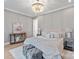 Elegant main bedroom featuring a chandelier, paneled walls, and soft, inviting decor at 4069 Rivendell Rd # 5, Denver, NC 28037