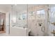 Luxurious shower with marble tile, glass enclosure, and modern fixtures at 4069 Rivendell Rd # 5, Denver, NC 28037