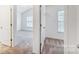 View of main bedroom and closet featuring neutral walls and carpets at 9345 Hamel St, Charlotte, NC 28215