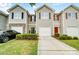 Townhome with neutral siding, attached garages, well-manicured lawns, and paved driveways at 9345 Hamel St, Charlotte, NC 28215