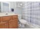 Clean bathroom with shower/tub combo and wood vanity at 13616 Morehouse St, Huntersville, NC 28078