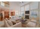 Spacious living room featuring a fireplace and a view into the kitchen at 2060 E Foxwood Ct, Indian Land, SC 29707