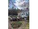 Spacious wooden deck with room for outdoor seating that complements the house's backyard at 949 Grace Ave, Lancaster, SC 29720