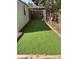 Backyard putting green with artificial turf, bordered by plants, and a wooden frame at 949 Grace Ave, Lancaster, SC 29720