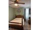Cozy bedroom features a wooden bed frame, clock and natural light at 949 Grace Ave, Lancaster, SC 29720
